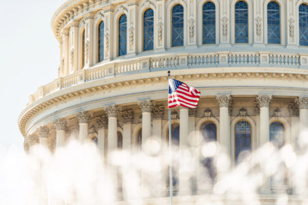 U.S. Congress building rotunda with U.S. flag